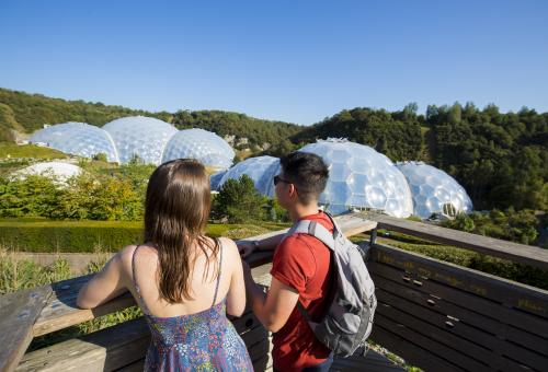 Young couple looking out at the view of the Eden Project